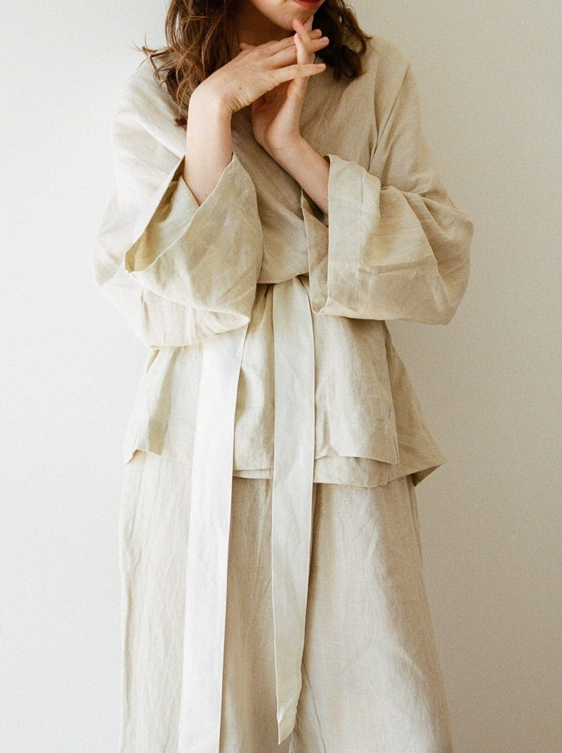 woman standing in beige kimono linen set with matching long pants