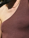 close-up of knitted brown asymmetrical top
