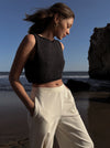 woman in black cropped tank top and white jersey pant