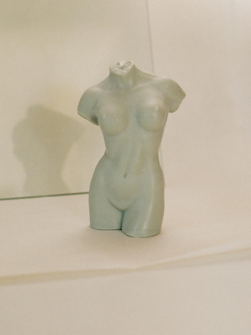 woman body shaped candle in sage color and white