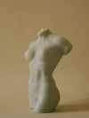 woman body shaped candle in sage color