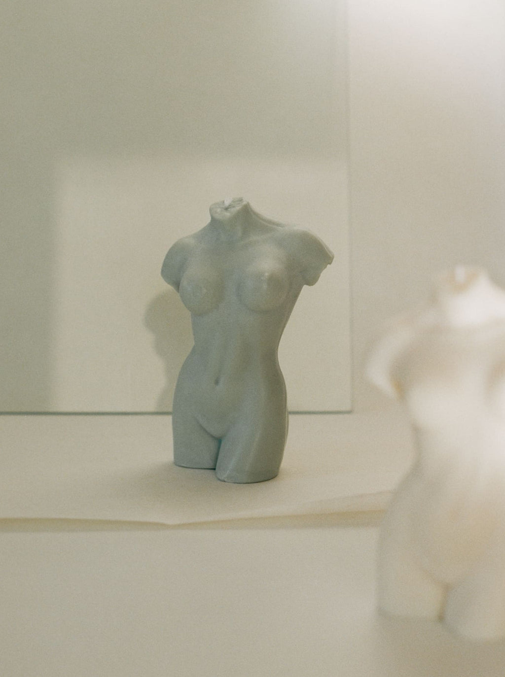 woman body shaped candle in sage color and white