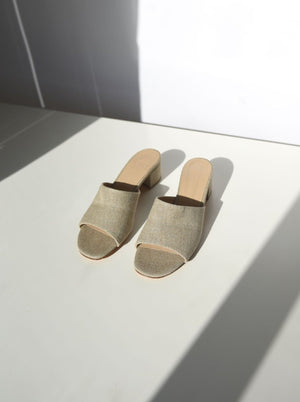 beige fabric covered slide heel sandal 